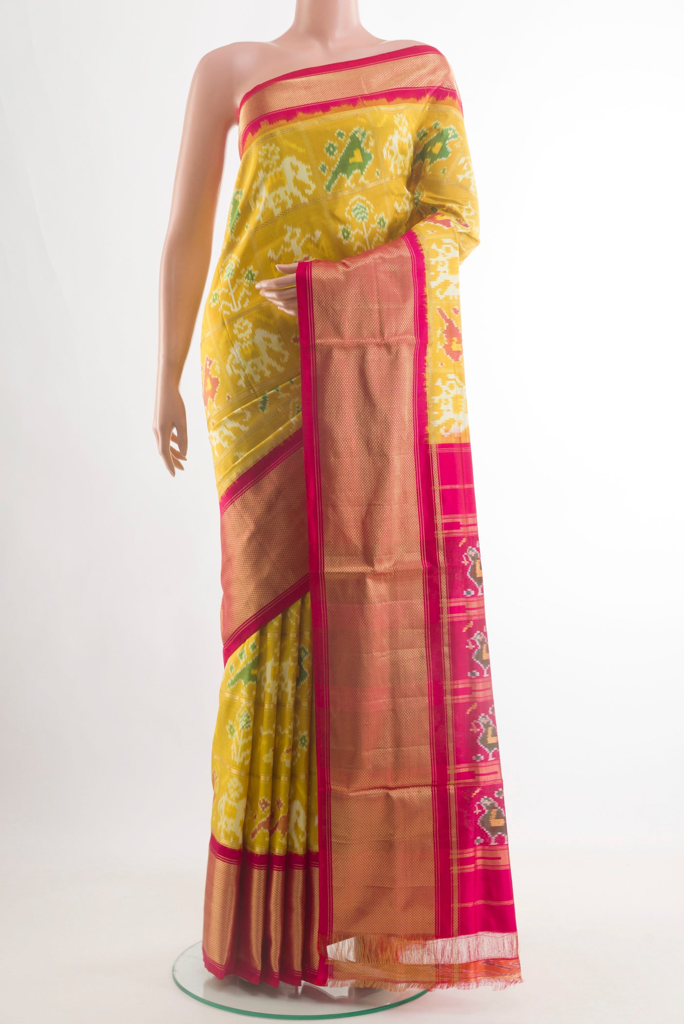Yellow Pochampally Silk Saree with Pure Ikat on the body and Zari Border.  displayed on a mannequin