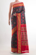 Navy Blue Pochampally Silk Saree with Pure Ikat on the body and Zari Border.  displayed on a mannequin
