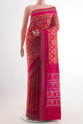 Pink Pochampally Silk Saree with Pure Ikat on the body and Plain Border.  displayed on a mannequin