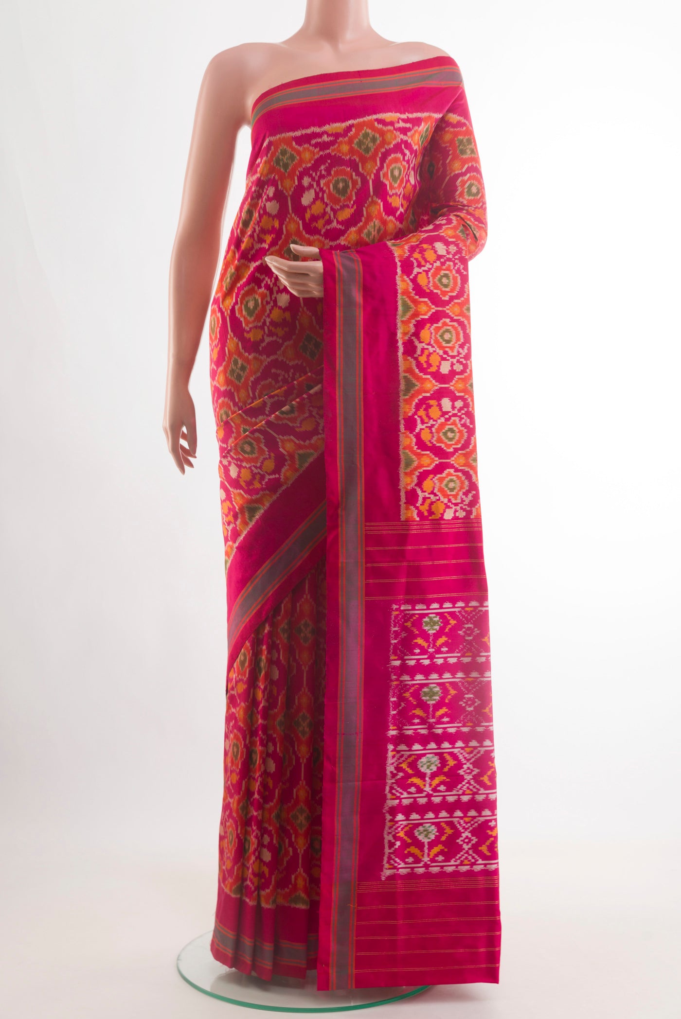 Pink Pochampally Silk Saree with Pure Ikat on the body and Plain Border.  displayed on a mannequin