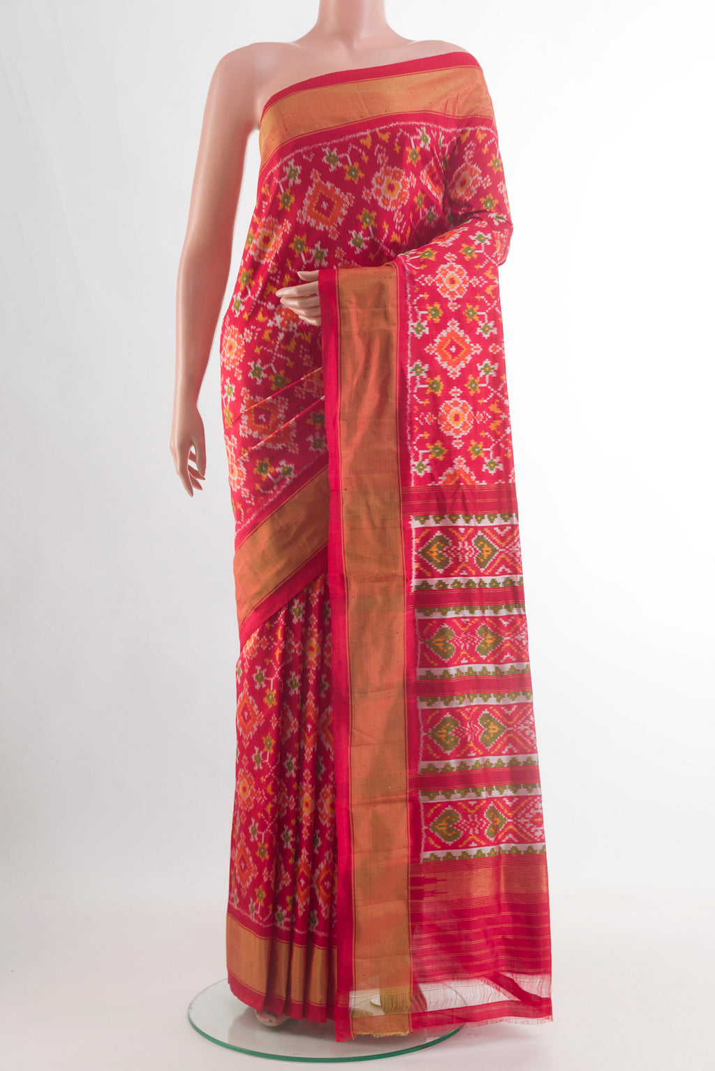 Red Pochampally Silk Saree with Ikat design on the body and Zari Border.  displayed on a mannequin