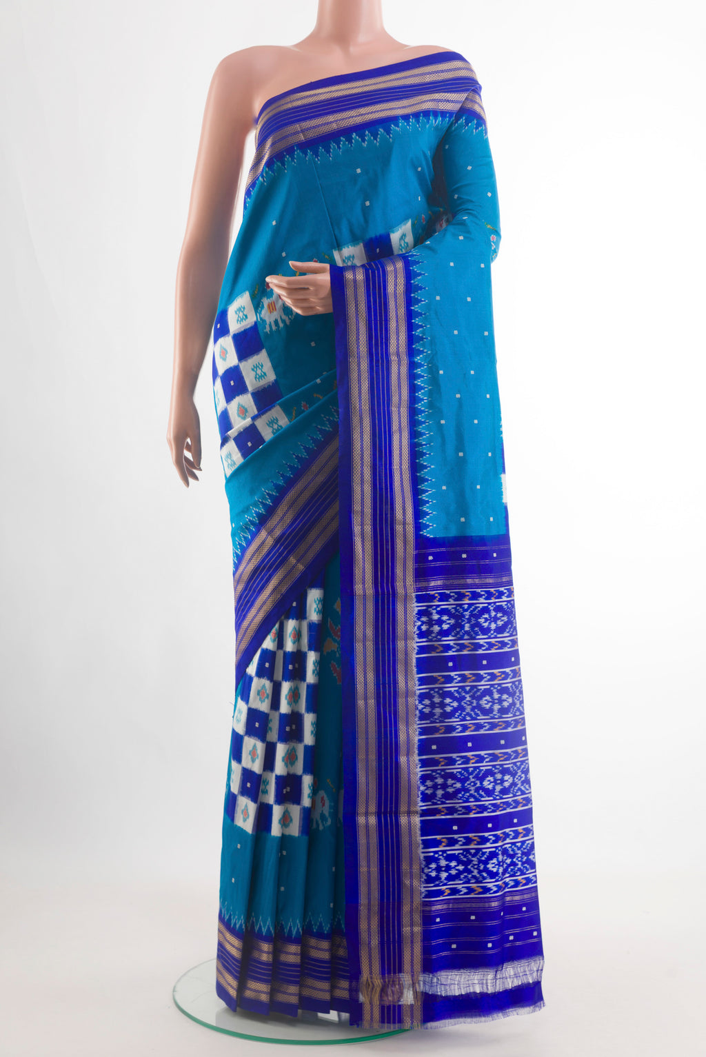 Blue Pochampally Silk Saree with Pure Ikat on the body and Zari Border.  displayed on a mannequin