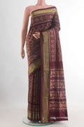Coffee Brown Pochampally Silk Saree with Ikat design on the body and Zari Border.  displayed on a mannequin