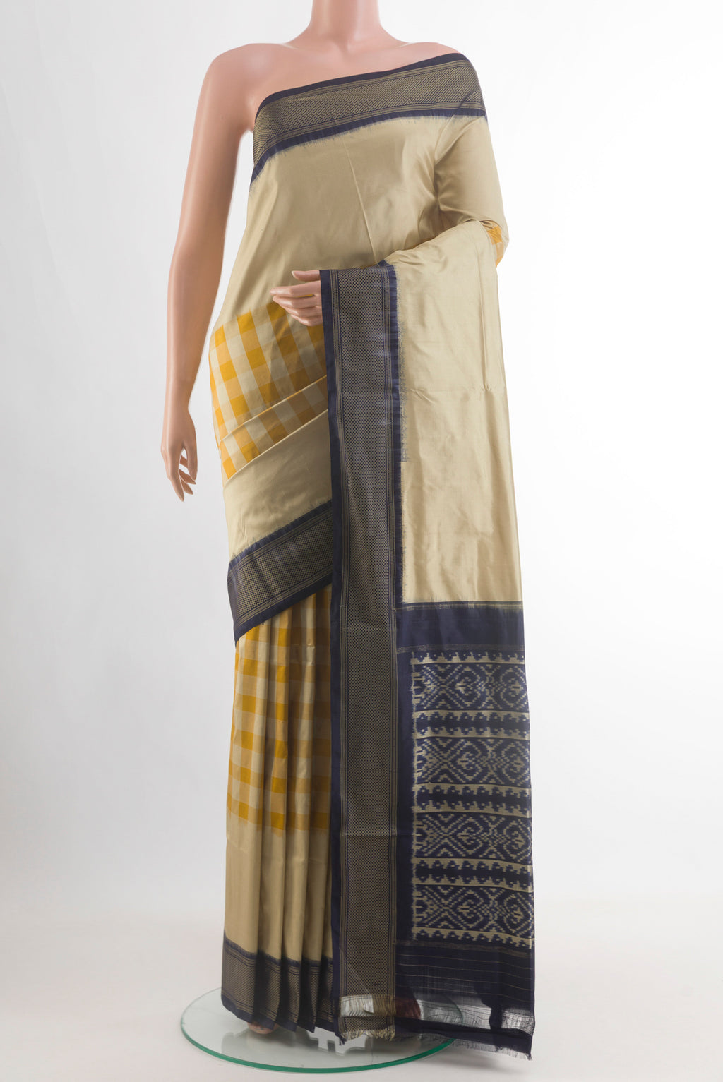 Beige Pochampally Silk Saree with Checked design on the body and Zari Border.  displayed on a mannequin