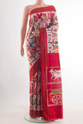 Rose Gold Pochampally Silk Saree with Pure Ikat on the body and Ikat Border.  displayed on a mannequin