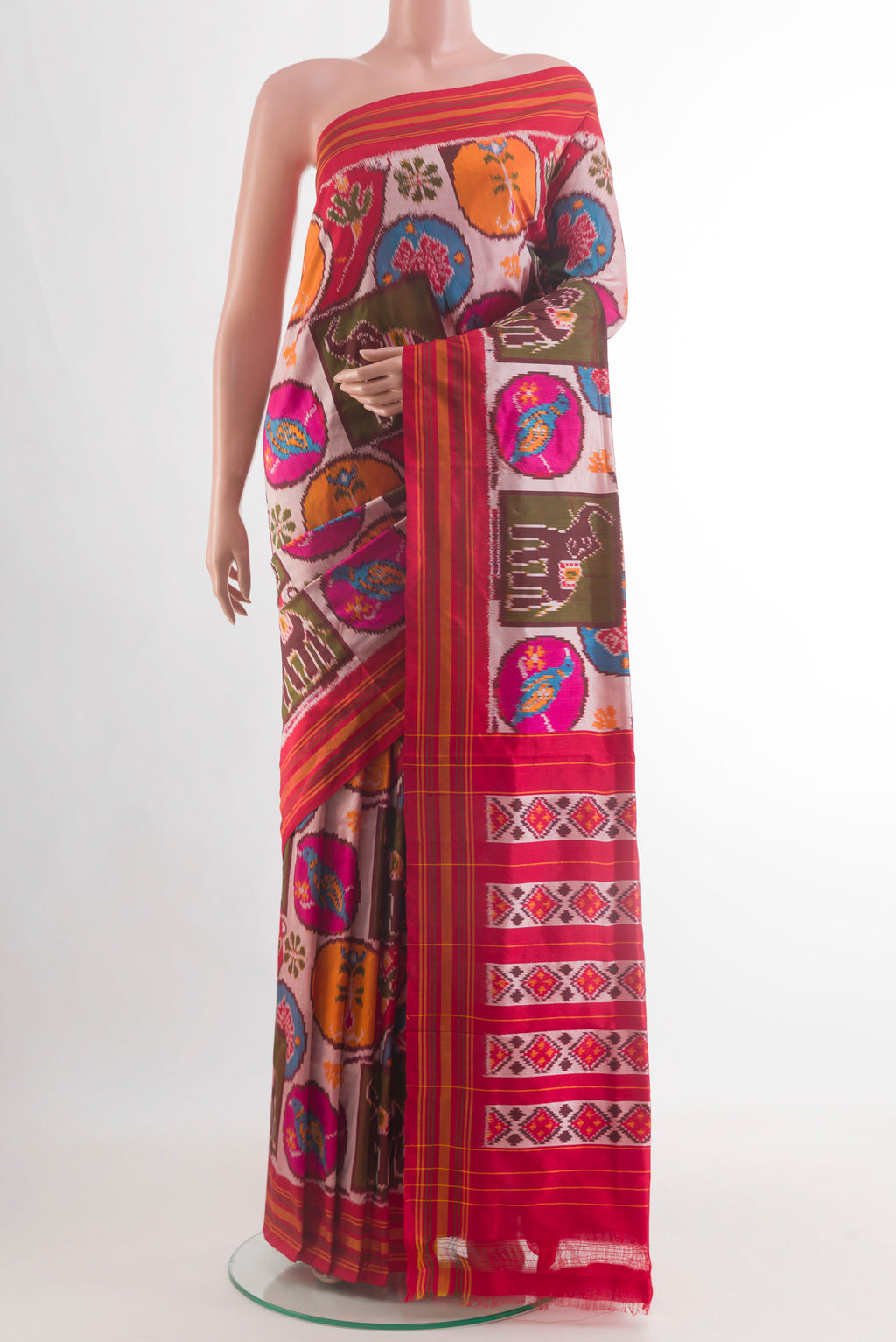 Multi Color Pochampally Silk Saree with Pure Ikat on the body and Plain Border.  displayed on a mannequin