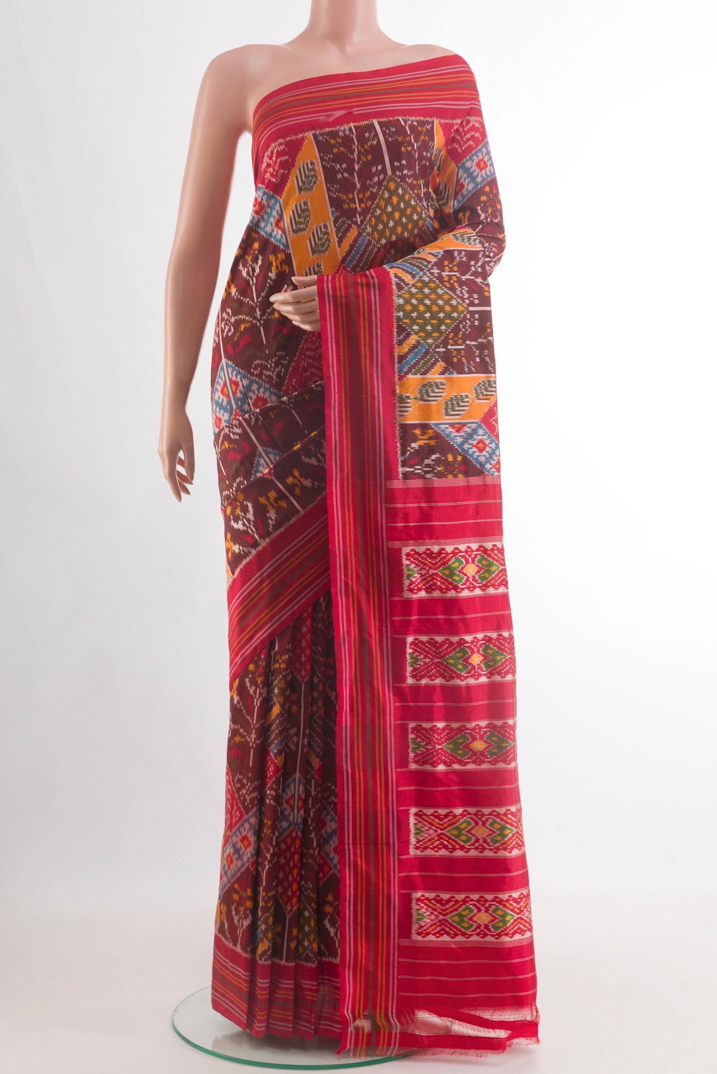 Maroon Pochampally Silk Saree with Pure Ikat on the body and Plain Border.  displayed on a mannequin