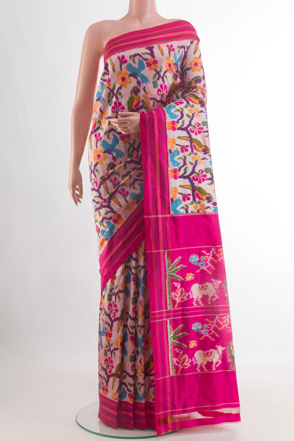 Off White Pochampally Silk Saree with Ikat design on the body and Plain Border.  displayed on a mannequin