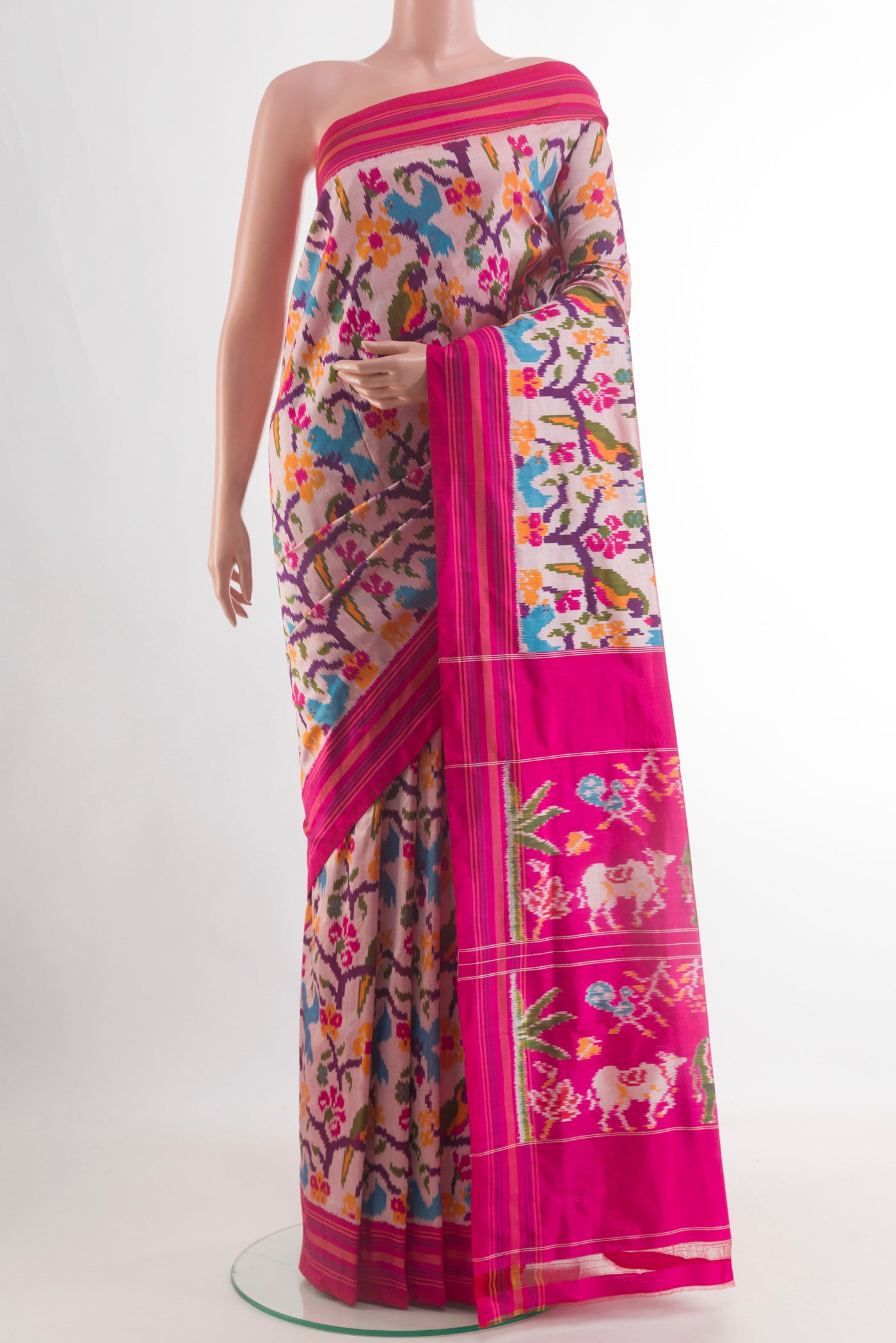 Off White Pochampally Silk Saree with Ikat design on the body and Plain Border.  displayed on a mannequin