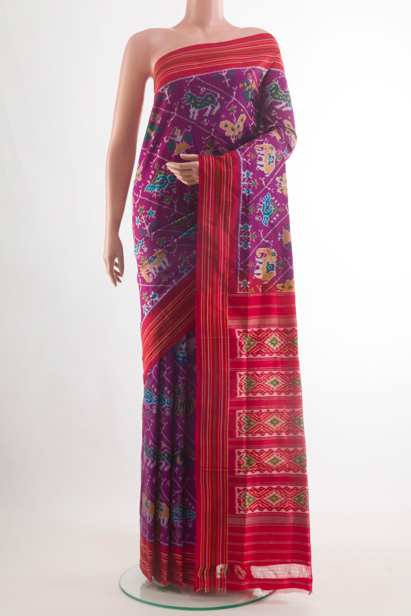 Purple Pochampally Silk Saree with Pure Ikat on the body and Plain Border.  displayed on a mannequin