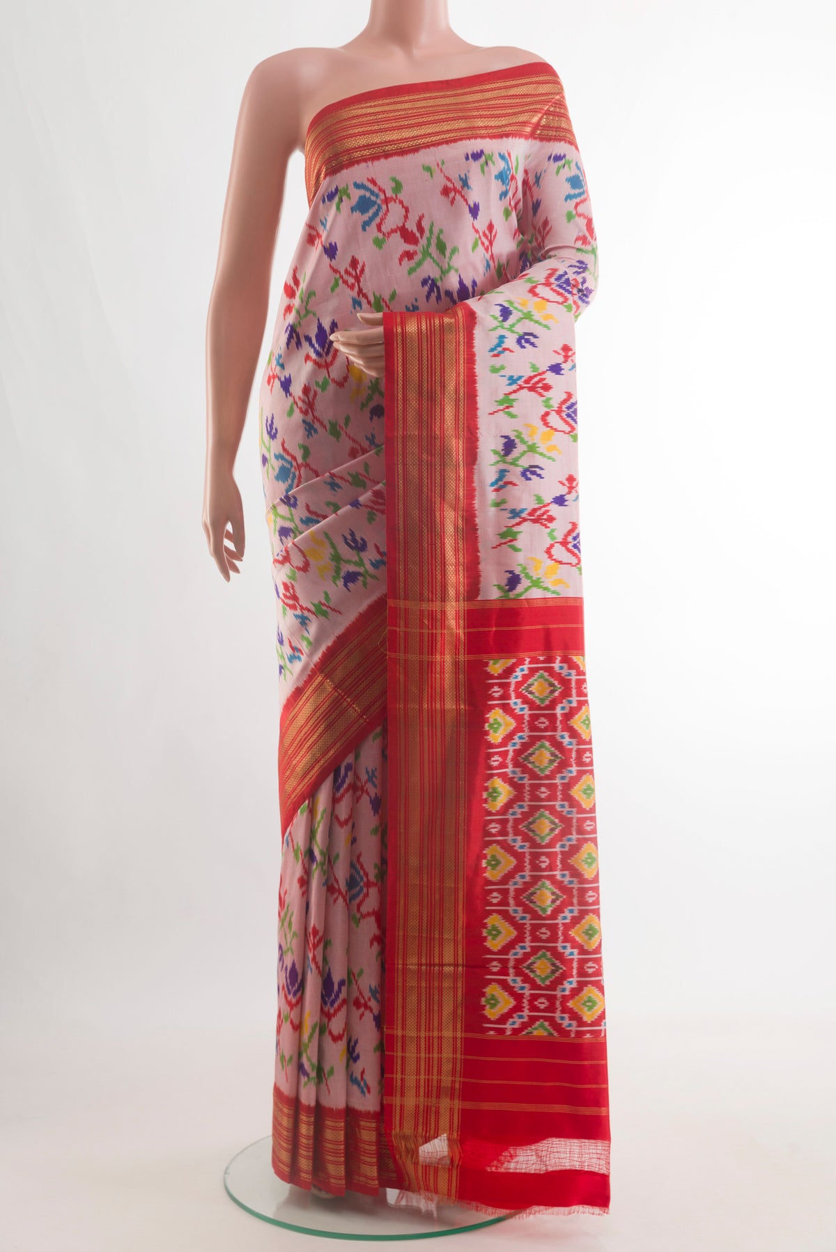 Rose pink Pochampally Silk Saree with Pure Ikat on the body and Zari Border.  displayed on a mannequin
