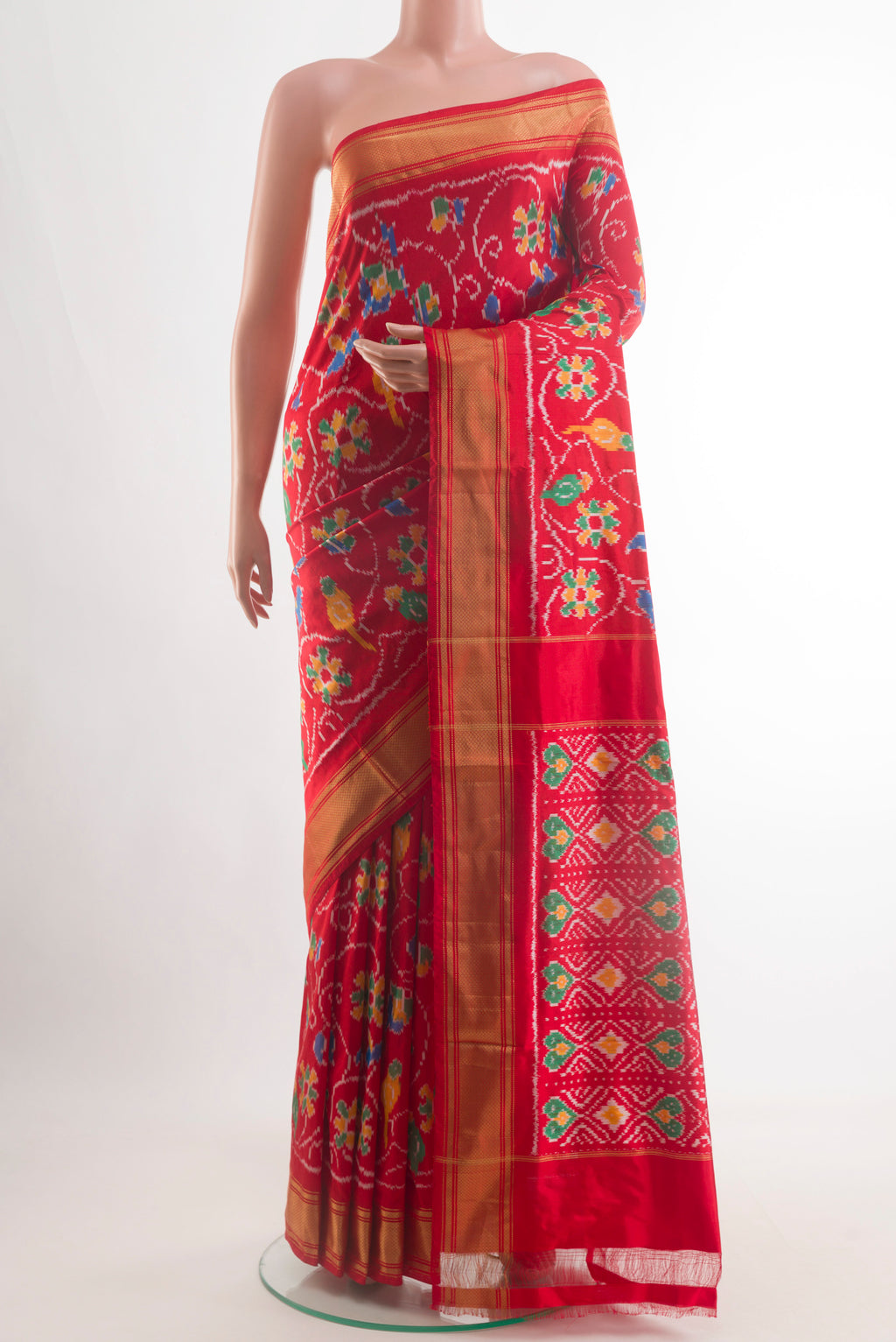 Red Pochampally Silk Saree with Pure Ikat on the body and Zari Border.  displayed on a mannequin