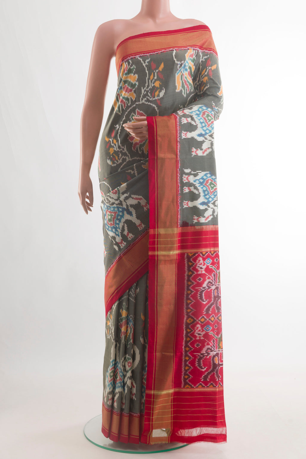 Grey Pochampally Silk Saree with Pure Ikat on the body and Zari Border.  displayed on a mannequin
