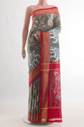 Grey Pochampally Silk Saree with Pure Ikat on the body and Zari Border.  displayed on a mannequin
