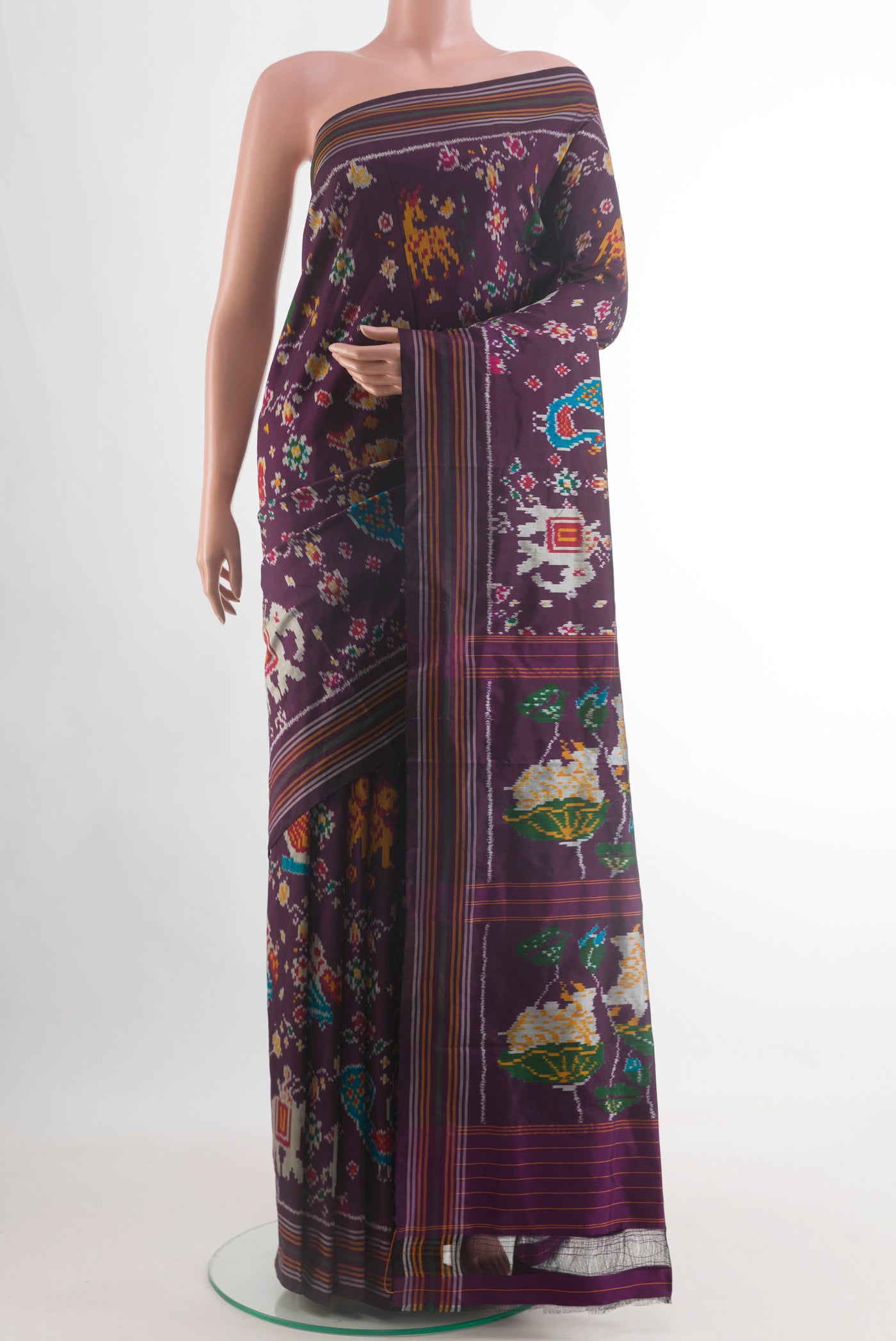 Purple Pochampally Silk Saree with Ikat design on the body and Plain Border.  displayed on a mannequin