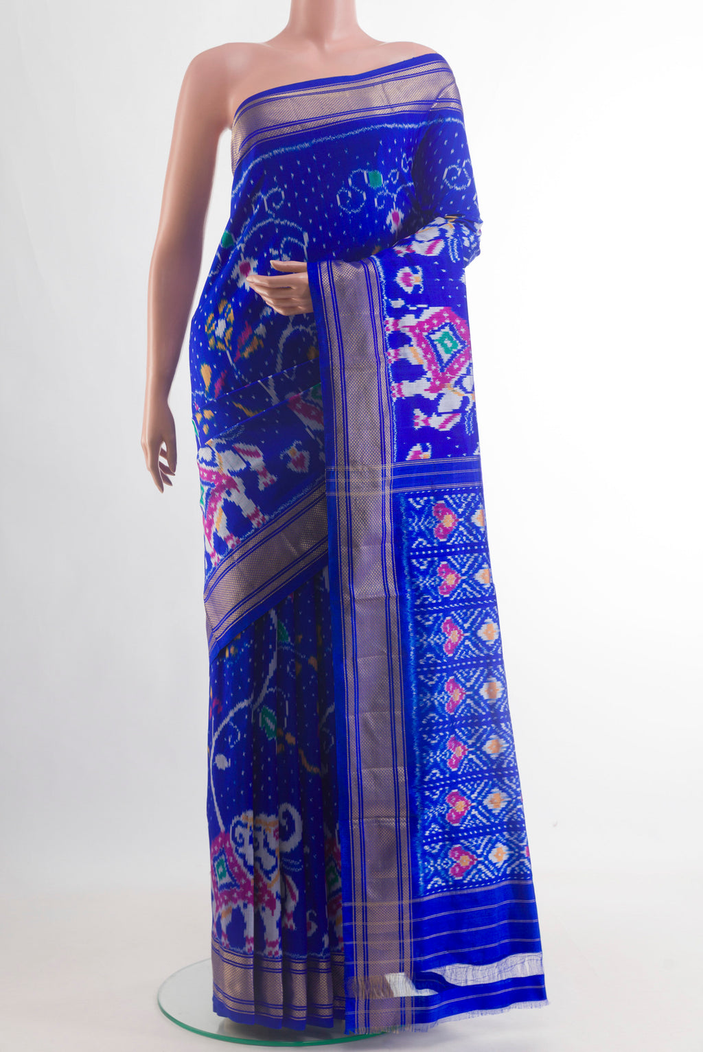 Royal Blue Pochampally Silk Saree with Ikat design on the body and Zari Border.  displayed on a mannequin
