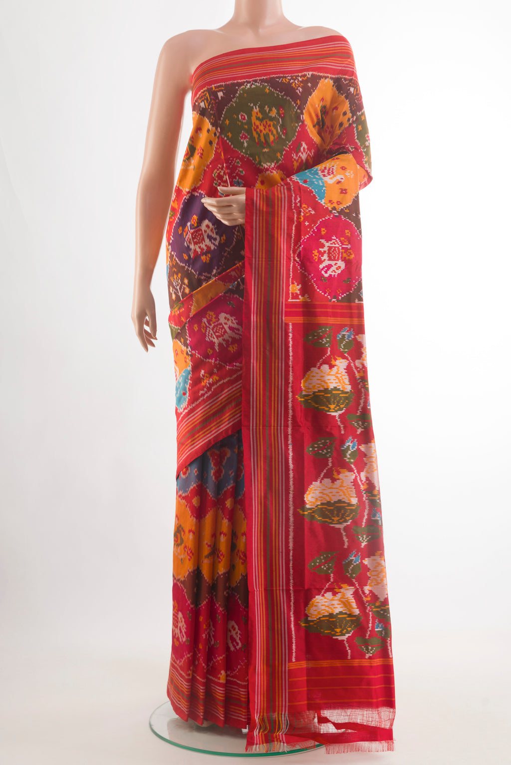 Multi Color Pochampally Silk Saree with Pure Ikat on the body and Plain Border.  displayed on a mannequin