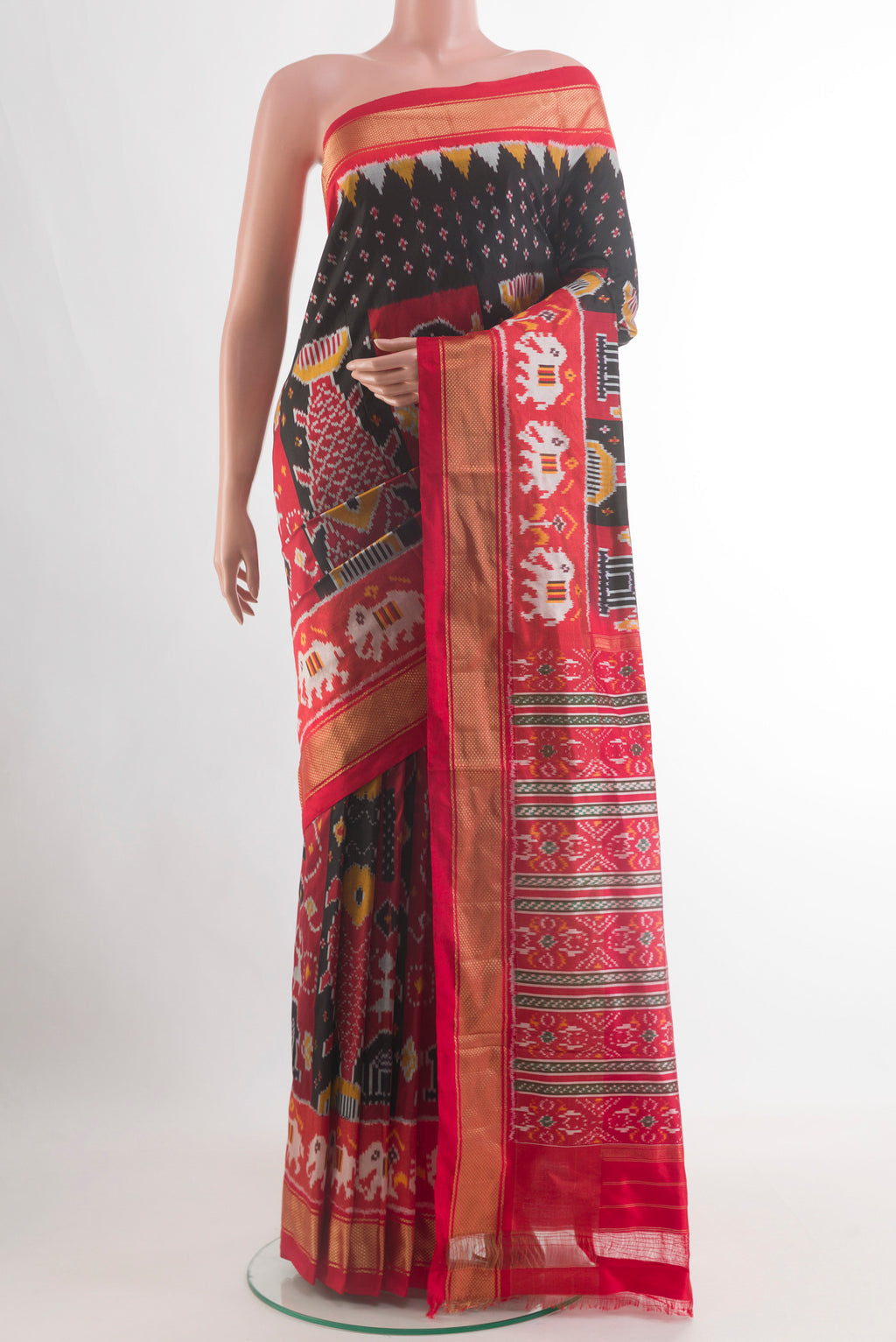 Black Pochampally Silk Saree with Pure Ikat on the body and Zari Border.  displayed on a mannequin