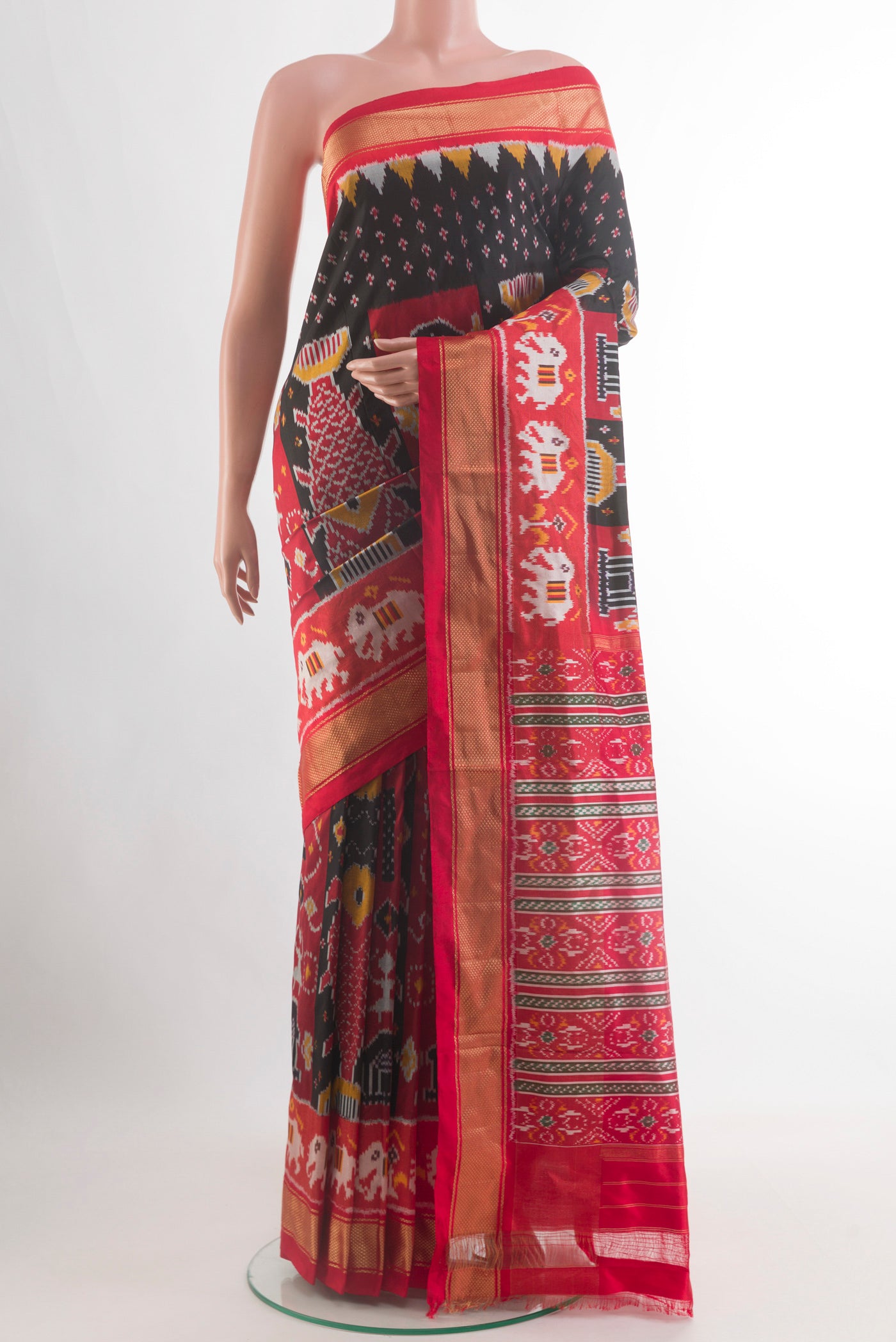 Black Pochampally Silk Saree with Pure Ikat on the body and Zari Border.  displayed on a mannequin