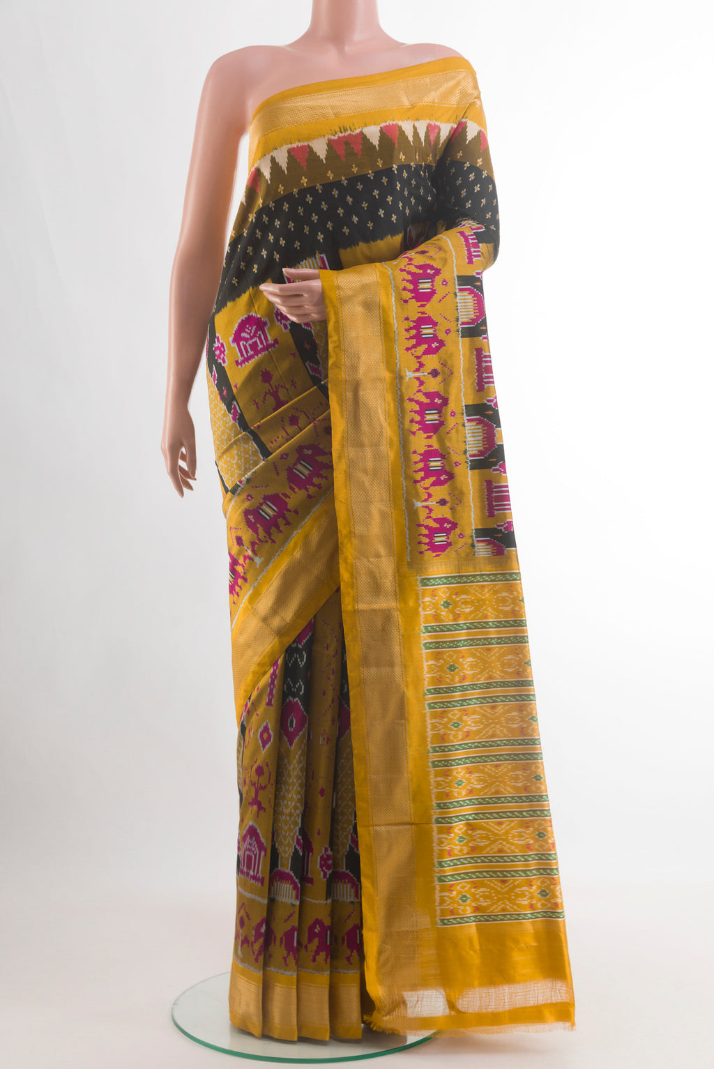 Black Pochampally Silk Saree with Ikat design on the body and Zari Border.  displayed on a mannequin
