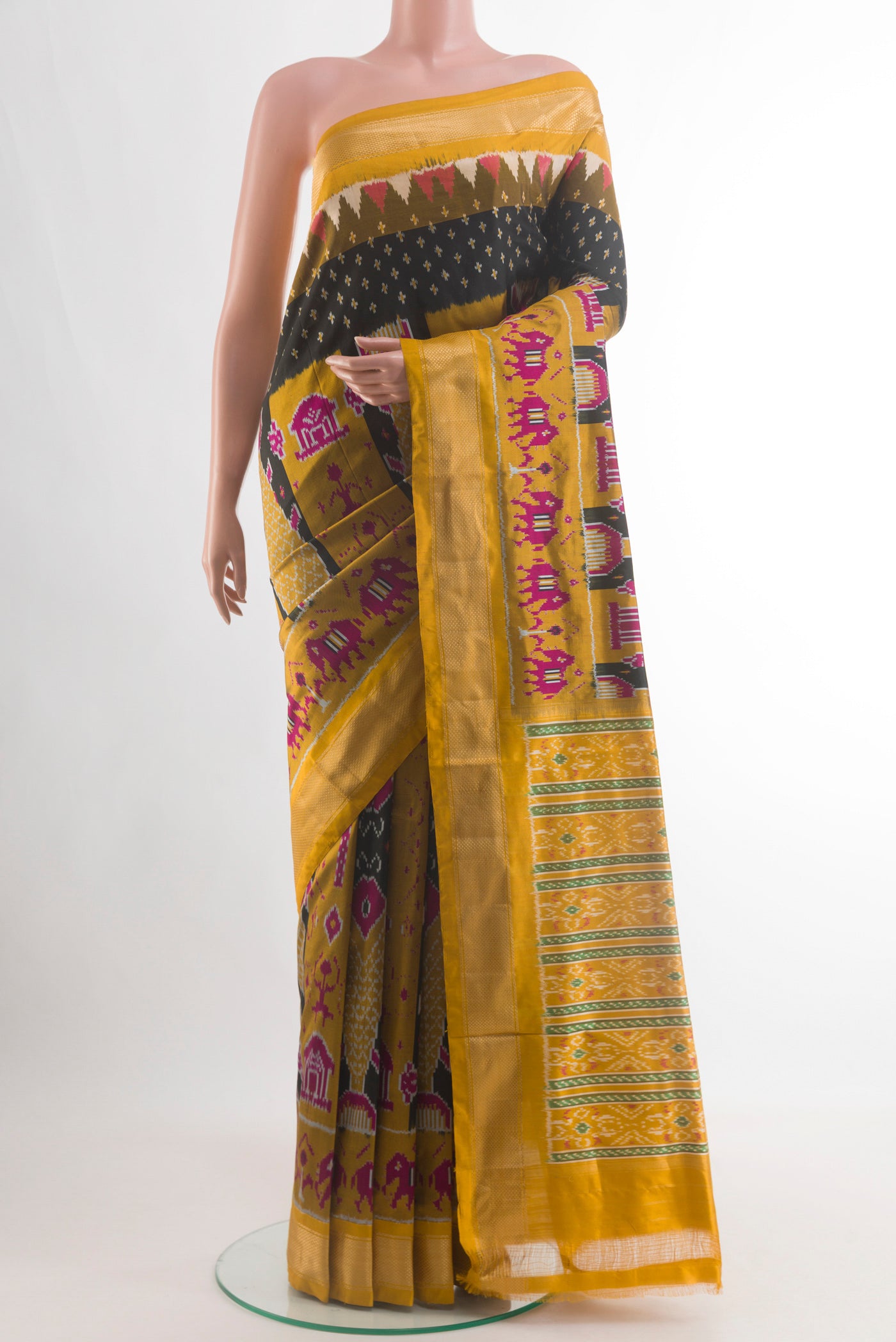 Black Pochampally Silk Saree with Ikat design on the body and Zari Border.  displayed on a mannequin