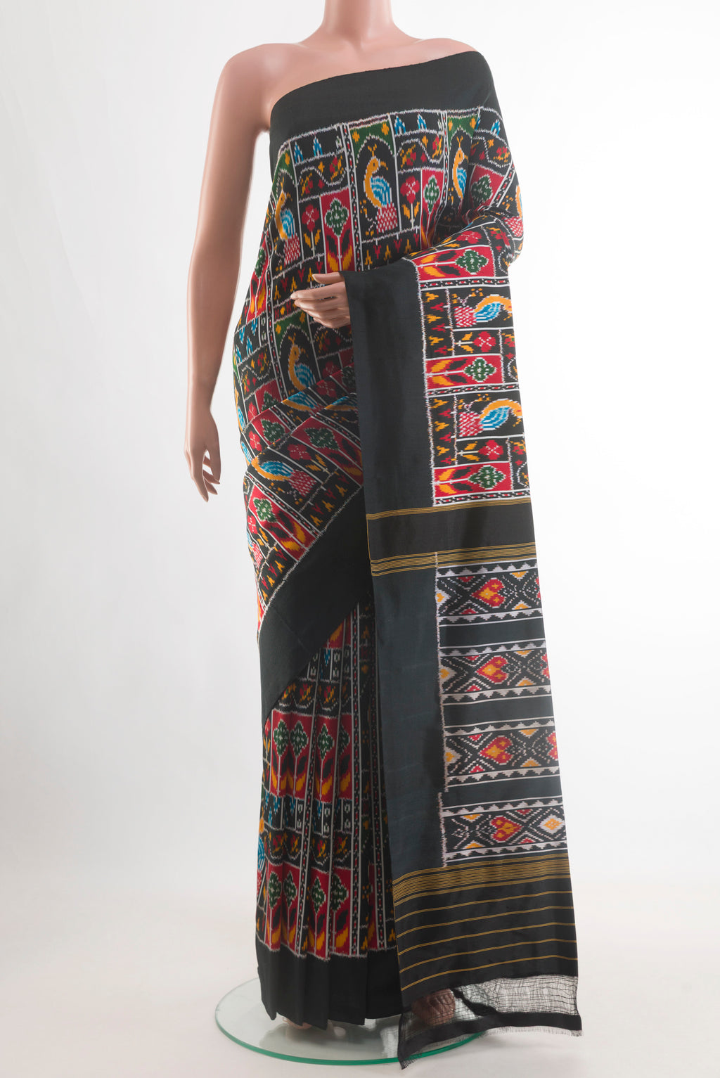 Black Pochampally Silk Saree with Pure Ikat on the body and Ikat Border.  displayed on a mannequin