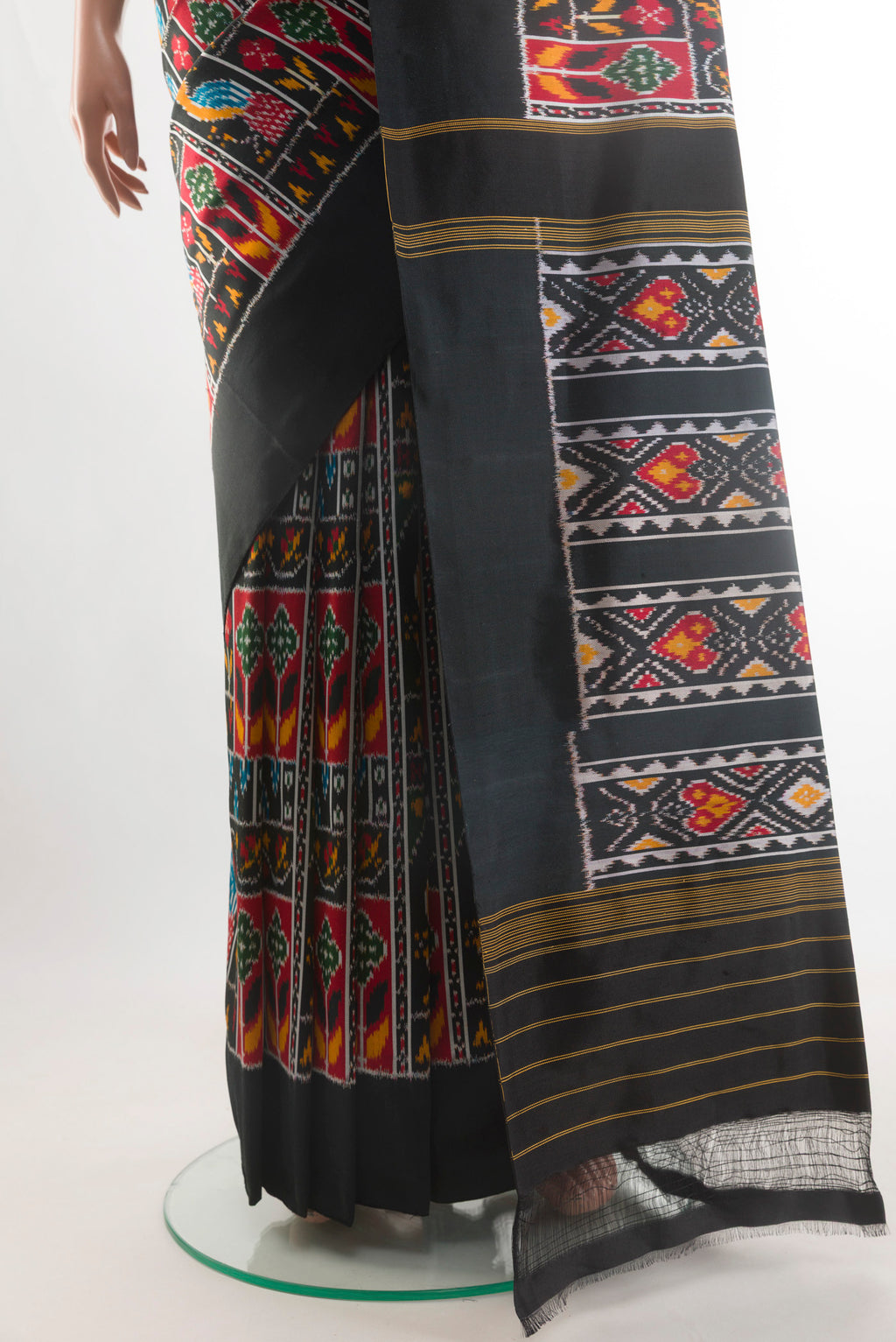 Pleats and pallu of Black Pochampally Silk Saree with Pure Ikat on the body and Ikat Border. 