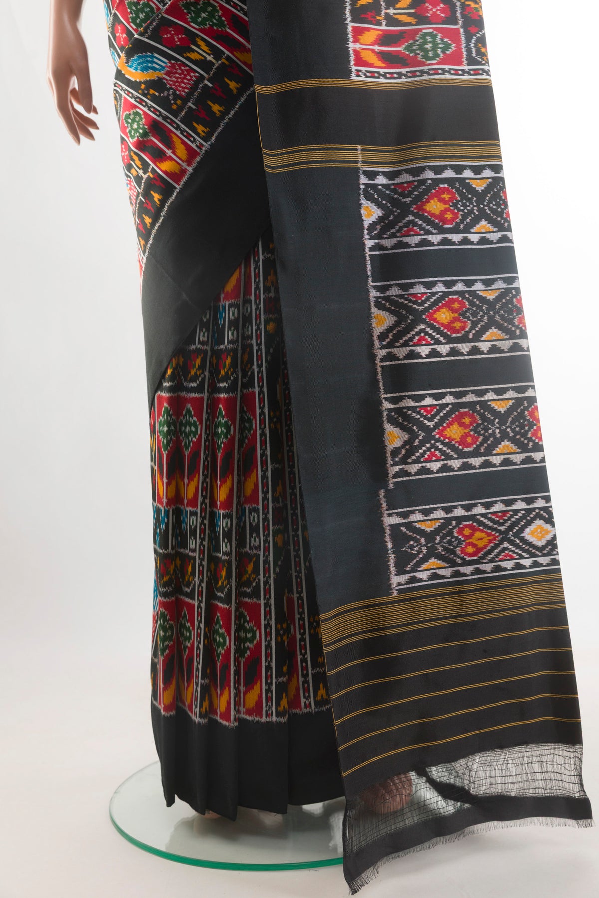 Pleats and pallu of Black Pochampally Silk Saree with Pure Ikat on the body and Ikat Border. 