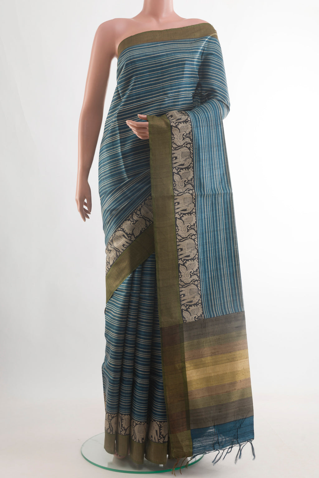 Blue Tussar Silk Saree with Stripes on the body and Zari Border.  displayed on a mannequin