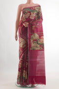 Magenta Tussar Silk Saree with Printed design on the body and Zari Border.  displayed on a mannequin