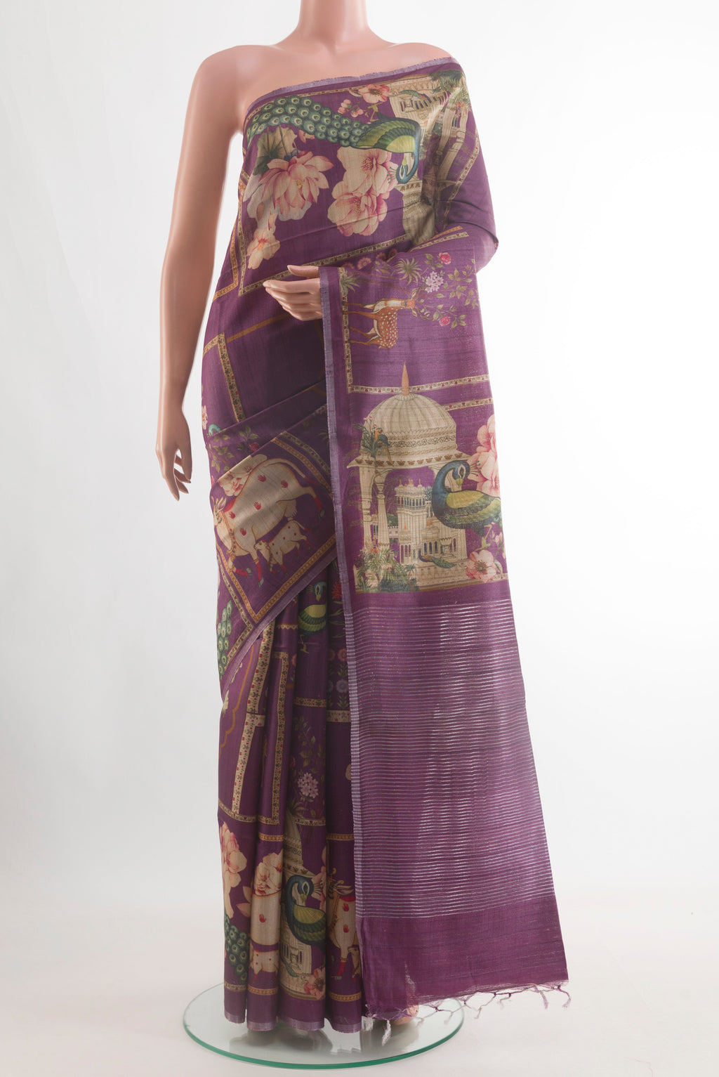 Purple Tussar Silk Saree with Floral Print on the body and Zari Border.  displayed on a mannequin