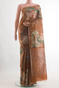 Brown Tussar Silk Saree with Printed design on the body and Zari Border.  displayed on a mannequin