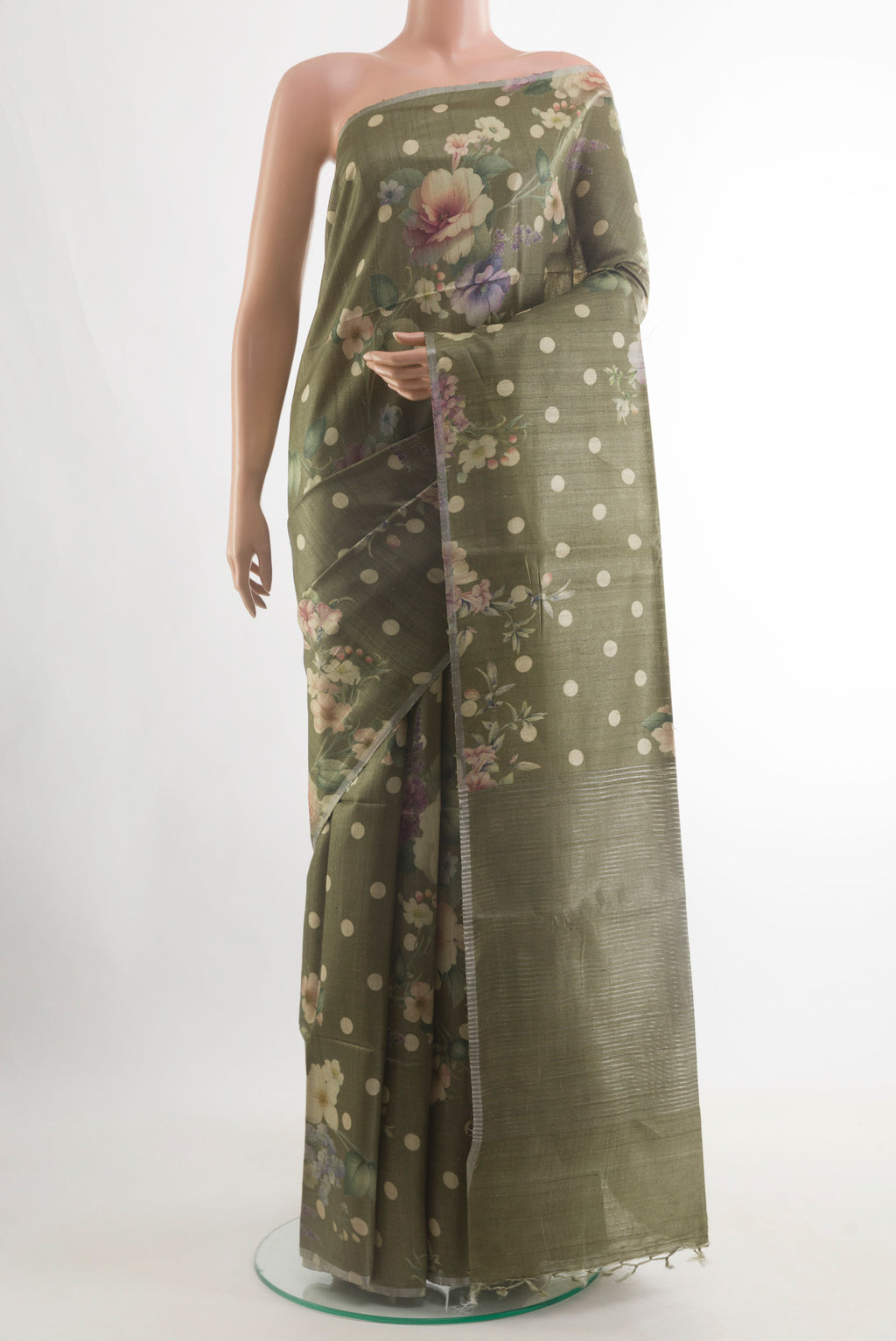 Mehandi Green Tussar Silk Saree with Floral Print on the body and Zari Border.  displayed on a mannequin