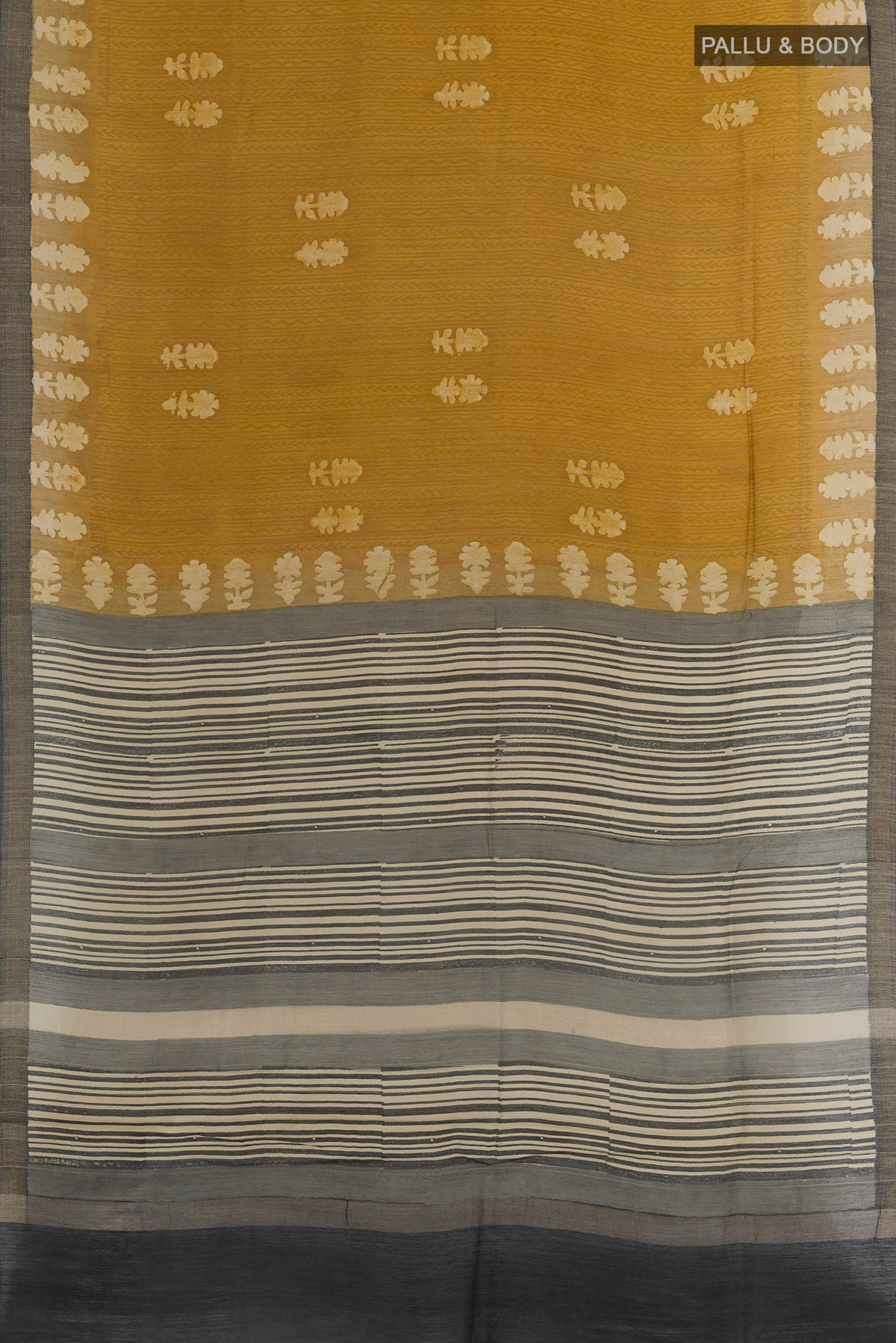 Flat view of Mehandi Green Tussar Silk Saree with Batik Print on the body and Zari Border. 