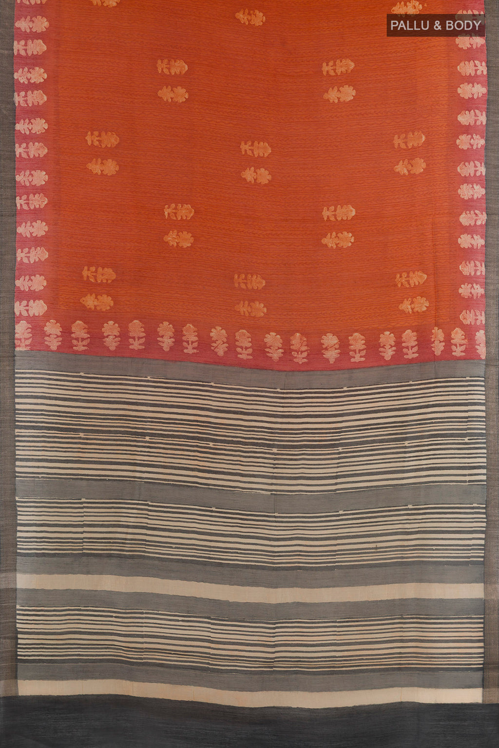 Flat view of Rust Tussar Silk Saree with Bandhani Print on the body and Zari Border. 
