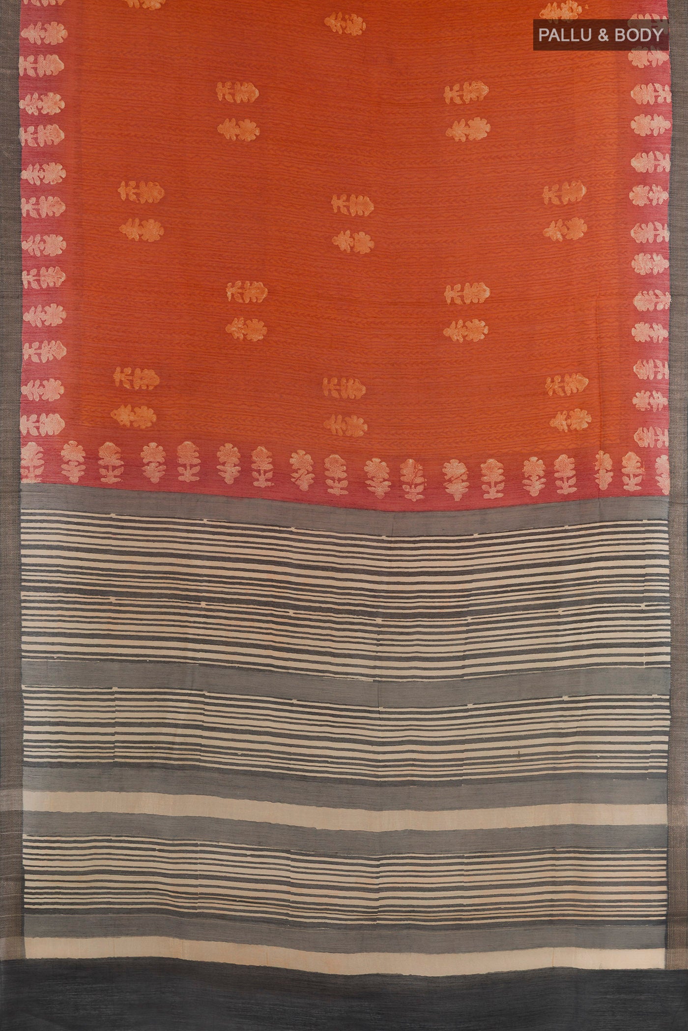 Flat view of Rust Tussar Silk Saree with Bandhani Print on the body and Zari Border. 