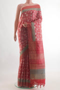 Red Tussar Silk Saree with Printed design on the body and Zari Border.  displayed on a mannequin