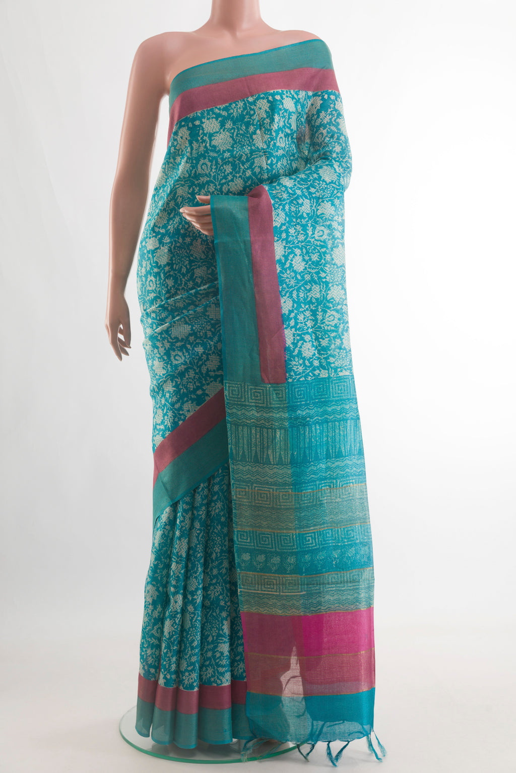 Blue Tussar Silk Saree with Printed design on the body and Zari Border.  displayed on a mannequin