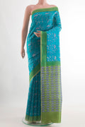 Blue Tussar Silk Saree with Printed design on the body and Printed Border.  displayed on a mannequin