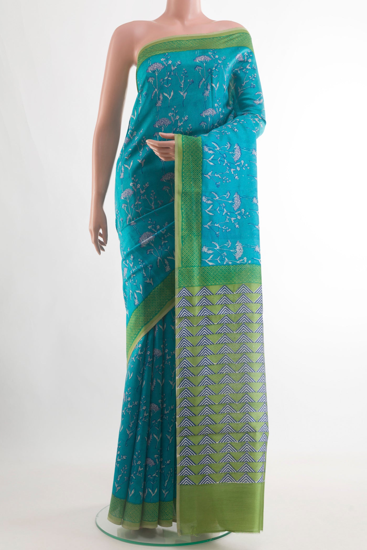 Blue Tussar Silk Saree with Printed design on the body and Printed Border.  displayed on a mannequin