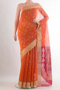 Orange Chanderi Cotton Saree with Zari Butta on the body and Zari Border.  displayed on a mannequin