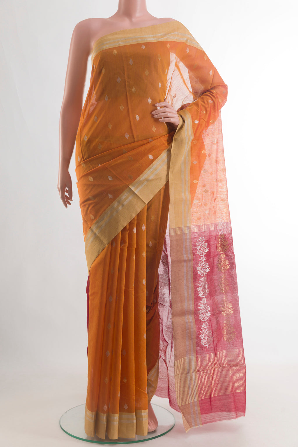 Pure Silk Mustard Chanderi Cotton Saree with Zari Butta on the body and Zari Border.  displayed on a mannequin