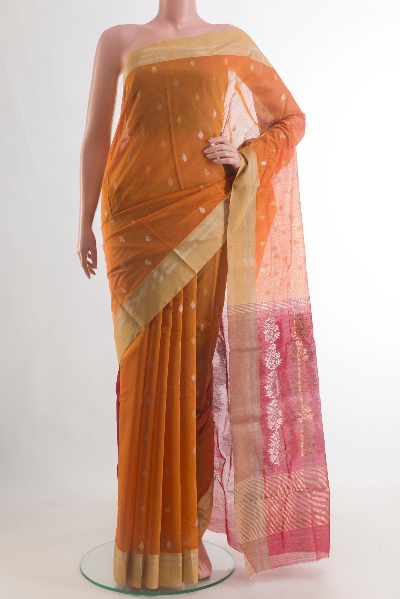 Pure Silk Mustard Chanderi Cotton Saree with Zari Butta on the body and Zari Border.  displayed on a mannequin