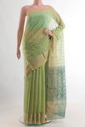 Light Green Blended Chanderi Silk Cotton Saree with Zari Butta on the body and Zari Border.  displayed on a mannequin