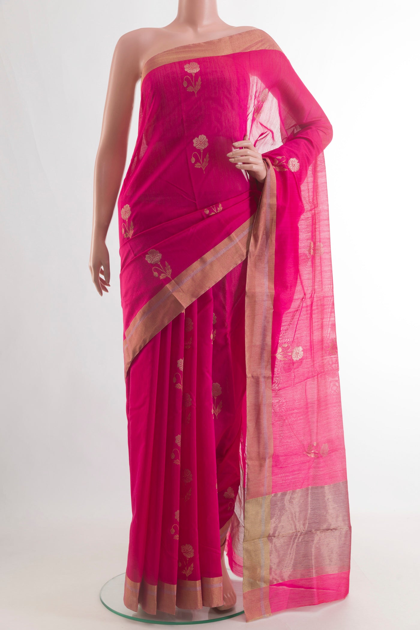 Pure Silk Pink Chanderi Cotton Saree with Zari Butta on the body and Zari Border.  displayed on a mannequin