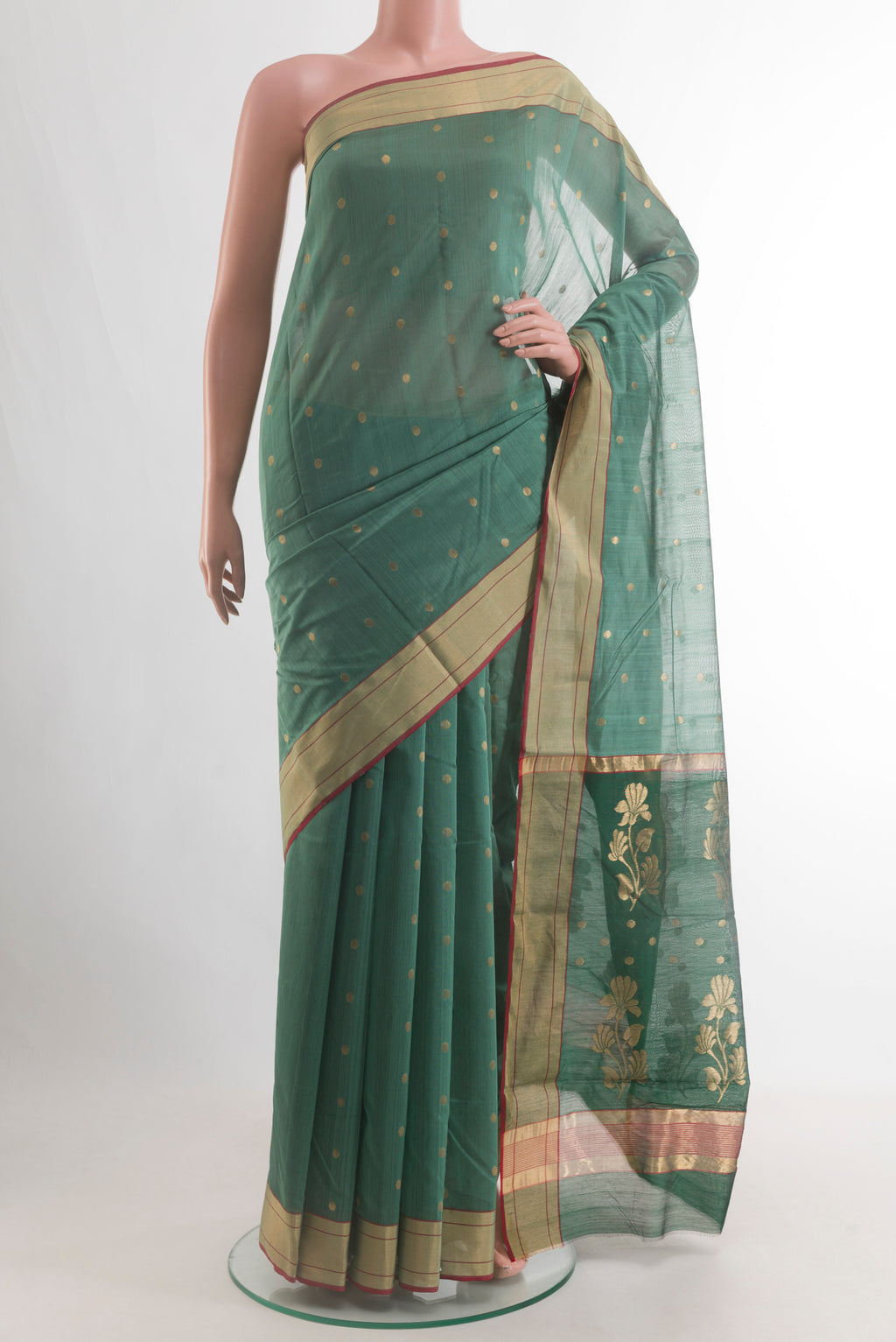 Pure Silk Green Chanderi Silk Cotton Saree with Zari Butta on the body and Zari Border.  displayed on a mannequin