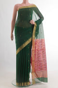 Pure Silk Bottle Green Chanderi Cotton Saree with Zari Butta on the body and Zari Border.  displayed on a mannequin