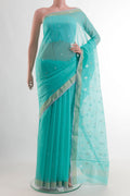 Pure Silk Sky Blue Chanderi Cotton Saree with Zari Butta on the body and Zari Border.  displayed on a mannequin