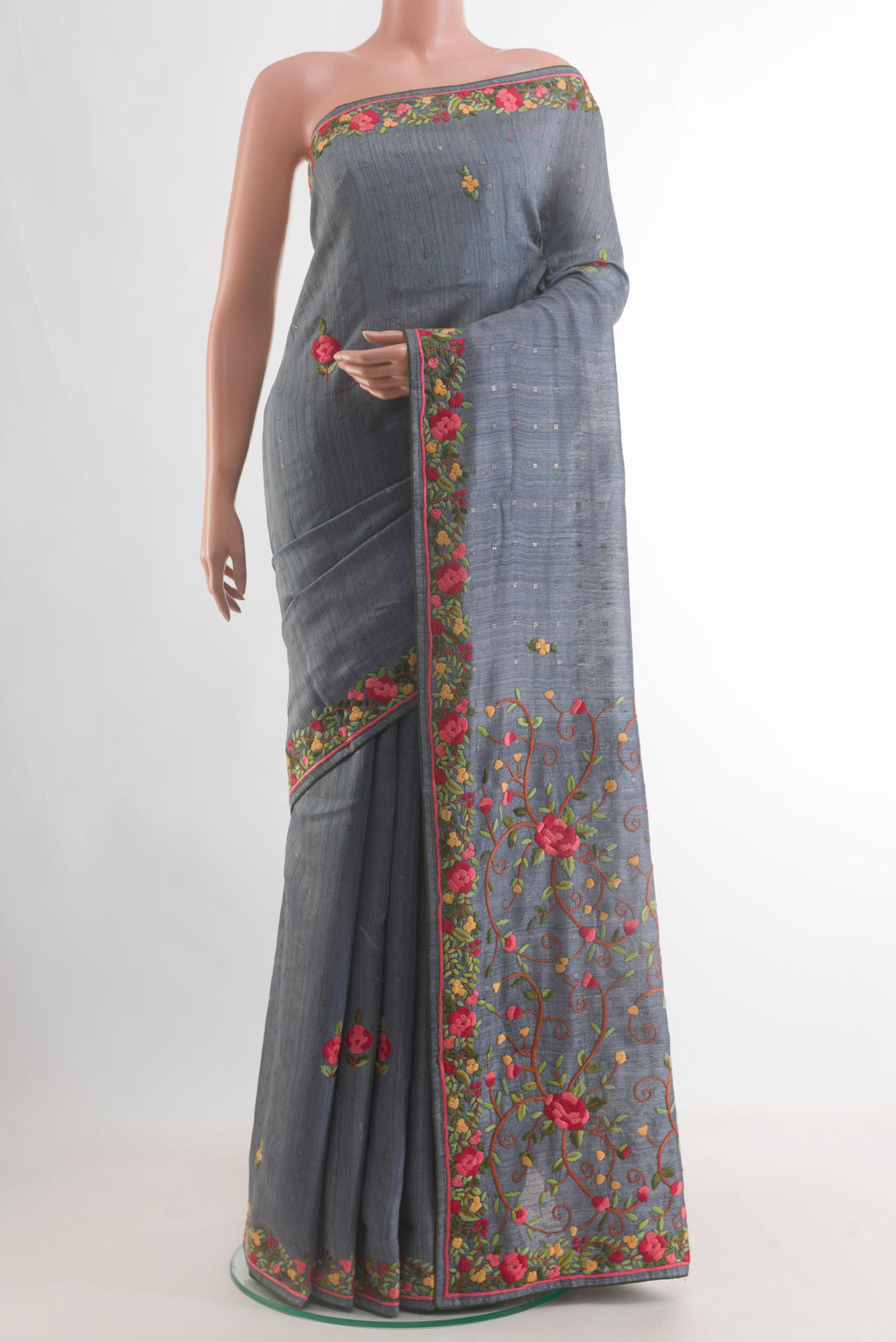 Blue Grey Tussar Saree with Embroidery on the body and Embroidery Border.  displayed on a mannequin