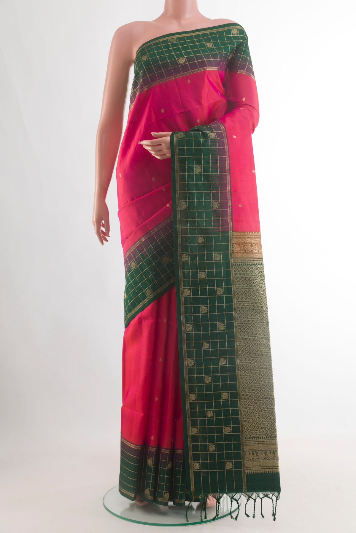Pure Silk Pink Soft Saree with Zari Butta on the body and Zari Border.  displayed on a mannequin